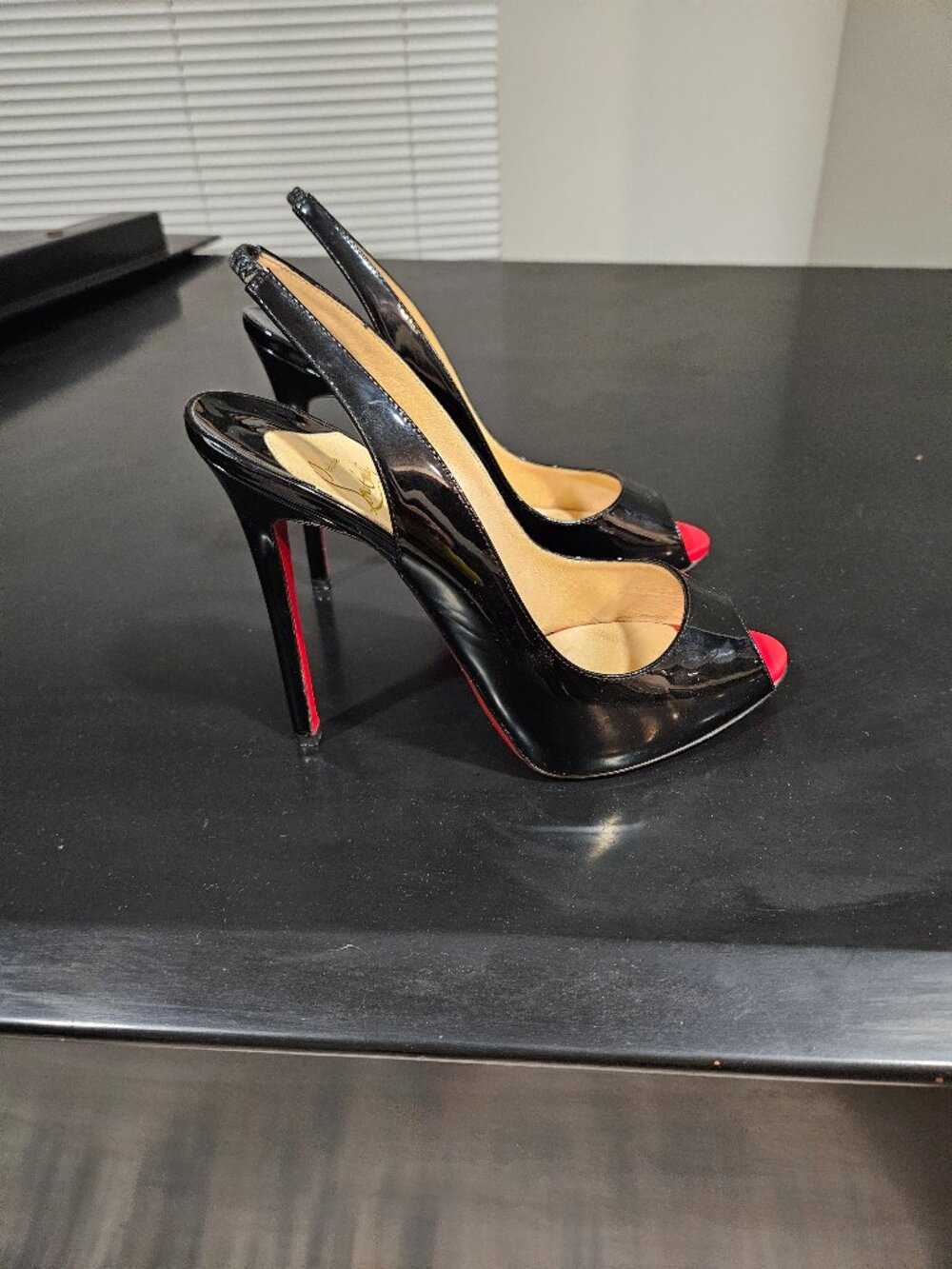 Christian Louboutin peep toe slingback stilletos. 5 inch heel. Size 41 or 10/ 11